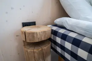 ložnice s dvojlůžkem (od společnosti Hästens) a klimatizací